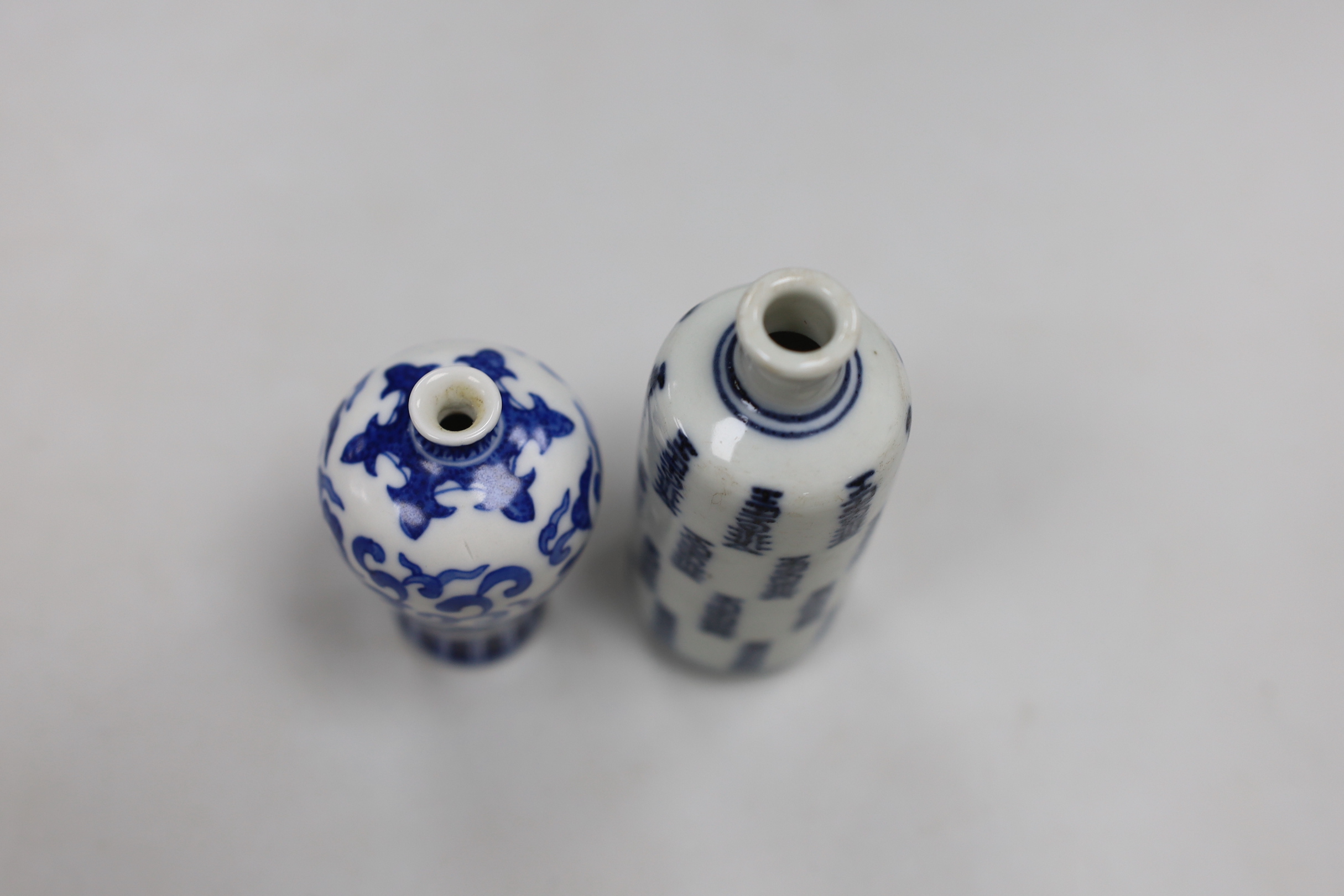 Two Chinese blue and white snuff bottles, tallest 9cm high